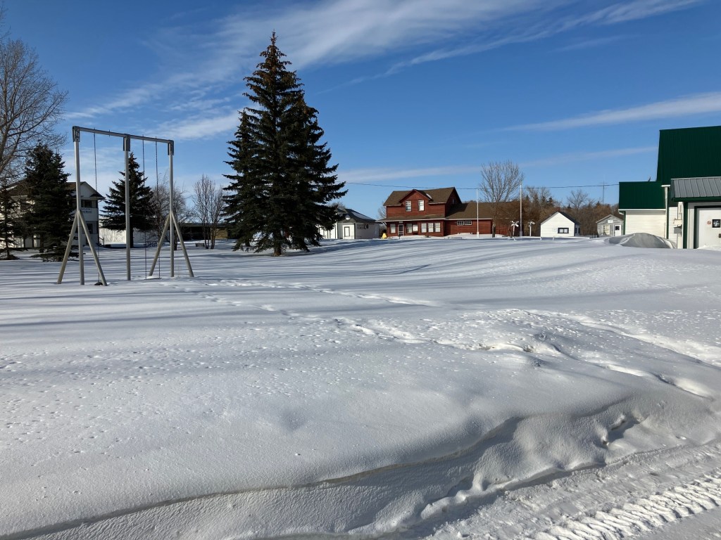 view of the heritage buildings across a field of snow