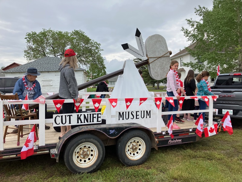 Museum Canada Day float with children and fiddler